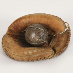 vintage leather baseball glove and softball